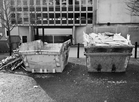 Builders skip on a construction site in Raynes Park